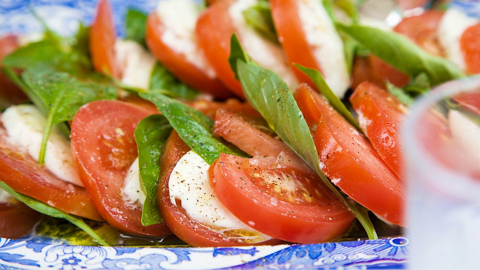 Caprese salad with a glass of white wine